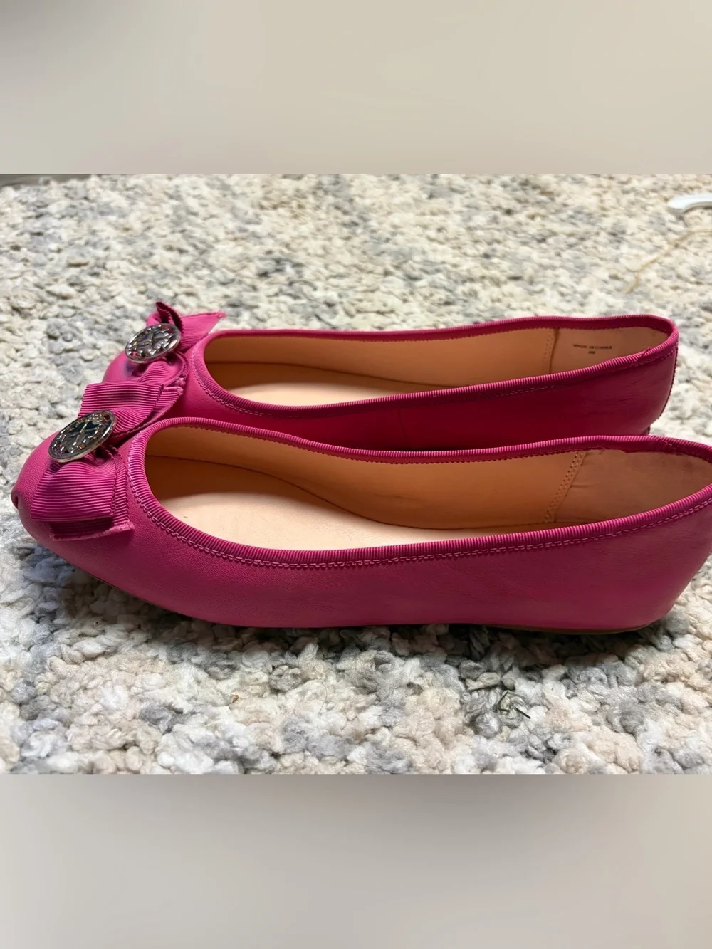 kate spade fuchsia bow ballet flats with logo medallion